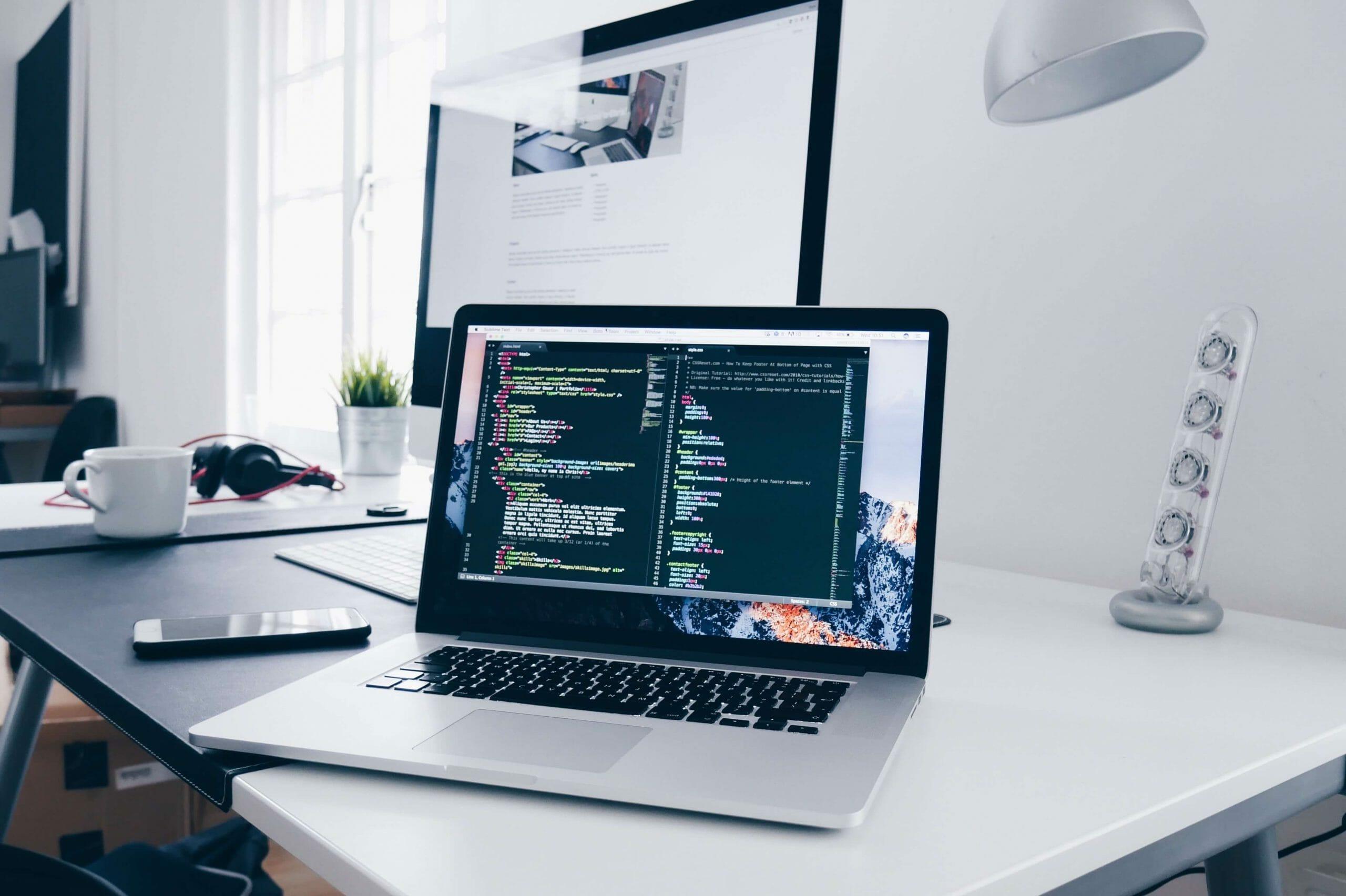 Photograph of a laptop viewing a code editor
