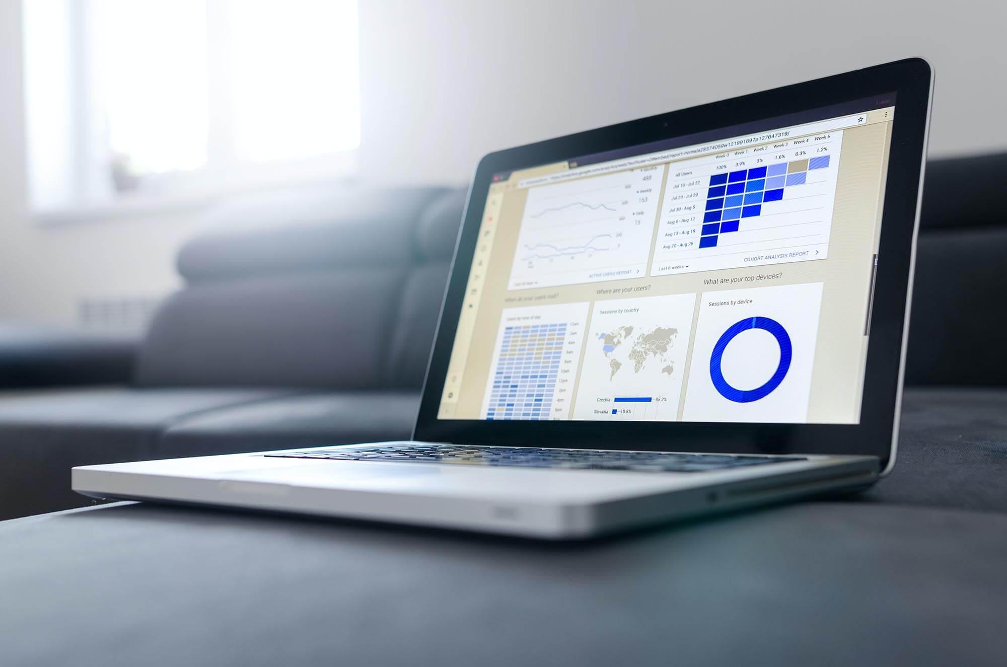 Photo of a laptop displaying various website analytics