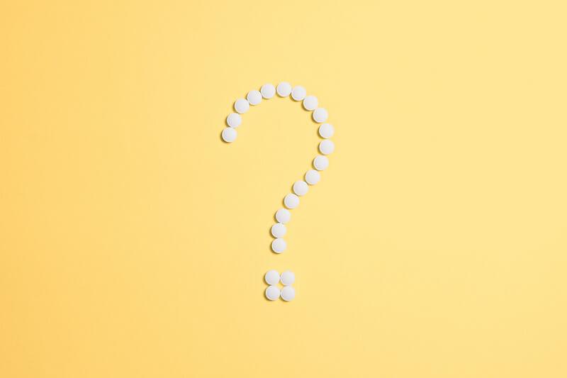 Canva White Beads on Question Mark Sign
