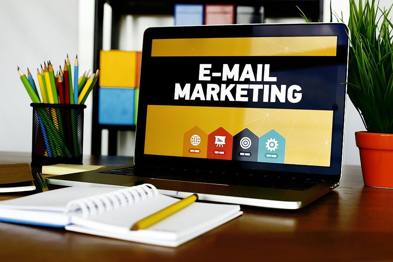 An illustration of a laptop showing a presentation on email marketing